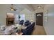 Inviting living room featuring vaulted ceilings, neutral paint, ceiling fan and a cozy fireplace at 522 W Dennis Ct, Tempe, AZ 85283
