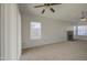 Bright and clean living room featuring vaulted ceilings, neutral paint, and a ceiling fan at 522 W Dennis Ct, Tempe, AZ 85283