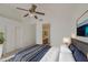 Spacious main bedroom featuring a ceiling fan and ensuite bathroom entrance at 522 W Dennis Ct, Tempe, AZ 85283