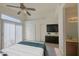 Bedroom with sliding glass doors, a ceiling fan, and an ensuite bathroom at 522 W Dennis Ct, Tempe, AZ 85283
