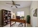 Bright home office with a wooden desk, bookshelf, and comfortable seating at 522 W Dennis Ct, Tempe, AZ 85283