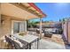 Spacious covered patio with dining and lounge areas, ideal for relaxing outdoors at 522 W Dennis Ct, Tempe, AZ 85283