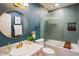 Stylish bathroom featuring blue walls, round mirror, and bathtub with shower with decorative tile at 5338 E Hearn Rd, Scottsdale, AZ 85254
