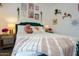 Cozy bedroom featuring unique decor, colorful artwork, and a comfortable bed with stylish bedding and side tables at 5338 E Hearn Rd, Scottsdale, AZ 85254