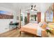 Cozy bedroom with desk, en-suite bathroom, ceiling fan, and abundant natural light at 5338 E Hearn Rd, Scottsdale, AZ 85254