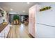 Open-concept kitchen and living room with light wood floors at 5338 E Hearn Rd, Scottsdale, AZ 85254
