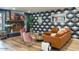 Inviting living room with fireplace, patterned wallpaper, and comfortable seating at 5338 E Hearn Rd, Scottsdale, AZ 85254
