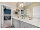 Bathroom featuring double sinks with white countertops and modern fixtures at 5516 N 193Rd Ave, Litchfield Park, AZ 85340