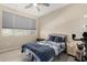 Neutral toned bedroom featuring a comfortable bed, window and matching nightstands at 5516 N 193Rd Ave, Litchfield Park, AZ 85340