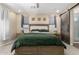 Bedroom featuring a wooden bed frame, natural light, and decorative wall art at 5516 N 193Rd Ave, Litchfield Park, AZ 85340