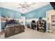 Unique bedroom with blue accent walls, wood-look floors, and stylish decor at 5516 N 193Rd Ave, Litchfield Park, AZ 85340