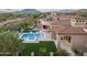 Aerial view of a luxurious home showcasing the pool, spa, and beautifully landscaped backyard at 7254 E Sonoran Trl, Scottsdale, AZ 85266