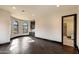 Spacious bonus room with wood flooring, a wet bar, and curved windows with beautiful views at 7254 E Sonoran Trl, Scottsdale, AZ 85266