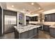 Spacious kitchen with stainless steel appliances, granite countertops and tile backsplash at 7254 E Sonoran Trl, Scottsdale, AZ 85266