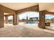 Stunning pool area with stone archway, pergola, and beautiful desert views at 7254 E Sonoran Trl, Scottsdale, AZ 85266
