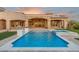 Resort-style pool and spa with integrated water features and lush landscaping at 7254 E Sonoran Trl, Scottsdale, AZ 85266