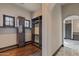 Custom walk-in closet featuring built-in shelving and drawers, wood flooring, and natural light at 7254 E Sonoran Trl, Scottsdale, AZ 85266