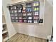 Walk-in closet featuring built-in shelving with a large display of shoes at 7313 S 25Th S Dr, Phoenix, AZ 85041