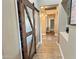 Hallway with tile floors and a barn door at 7313 S 25Th S Dr, Phoenix, AZ 85041
