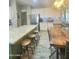 Spacious kitchen featuring granite countertops, an island with barstools, and stainless steel appliances at 7313 S 25Th S Dr, Phoenix, AZ 85041