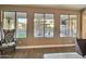 Living room view showcasing the large windows, view of pool, and comfortable seating arrangement at 7313 S 25Th S Dr, Phoenix, AZ 85041