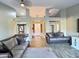 Open concept living space with high ceilings, tile floors, and comfortable seating at 7313 S 25Th S Dr, Phoenix, AZ 85041