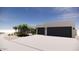 Spacious modern home with a large two-car garage and professionally designed desert landscaping at 8528 E Clydesdale Trl, Scottsdale, AZ 85258