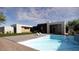 Inviting backyard pool with lounge chairs and a modern home exterior, perfect for relaxation and entertaining at 8528 E Clydesdale Trl, Scottsdale, AZ 85258