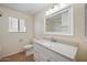 Bright bathroom with white vanity, granite countertop, and modern fixtures at 874 E Lamonte St, San Tan Valley, AZ 85140