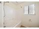 Clean bathroom featuring a shower-tub combo and neutral colors at 874 E Lamonte St, San Tan Valley, AZ 85140