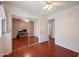 Bedroom featuring hardwood floors, ceiling fan, and mirrored closet doors at 874 E Lamonte St, San Tan Valley, AZ 85140