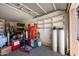 A spacious garage with ample storage, shelving, and room for parking, providing convenience and organization at 874 E Lamonte St, San Tan Valley, AZ 85140
