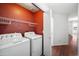 Spacious laundry room with side-by-side washer and dryer at 874 E Lamonte St, San Tan Valley, AZ 85140