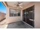 Covered patio featuring a ceiling fan, neutral walls, and sliding glass doors for seamless indoor-outdoor living at 874 E Lamonte St, San Tan Valley, AZ 85140