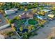 Stunning aerial view of a desert home with a pool, lush landscaping, and well manicured turf at 9183 W Shamel Ash Rd, Peoria, AZ 85383