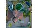 Aerial shot displaying a home, turf, and pool for outdoor entertainment at 9183 W Shamel Ash Rd, Peoria, AZ 85383