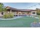 Open backyard with manicured lawn and covered patio ideal for outdoor entertaining at 9183 W Shamel Ash Rd, Peoria, AZ 85383