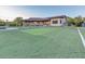Spacious backyard featuring a large grassy area and stunning home exterior at 9183 W Shamel Ash Rd, Peoria, AZ 85383