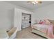 Bedroom featuring a closet, bed, and herringbone wood flooring at 9183 W Shamel Ash Rd, Peoria, AZ 85383