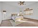 Bright bedroom boasts an ensuite and plenty of natural light from many windows at 9183 W Shamel Ash Rd, Peoria, AZ 85383