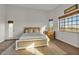 Comfortable bedroom with neutral tones and direct access to the ensuite bathroom at 9183 W Shamel Ash Rd, Peoria, AZ 85383