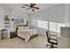 Bedroom featuring a bed, herringbone wood floor, and a ceiling fan at 9183 W Shamel Ash Rd, Peoria, AZ 85383