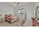 Bedroom featuring a bed, pink accents, and herringbone wood flooring at 9183 W Shamel Ash Rd, Peoria, AZ 85383