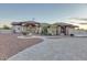 Elegant home with a circular driveway, fountain, and well-maintained landscaping, offering stunning curb appeal at 9183 W Shamel Ash Rd, Peoria, AZ 85383