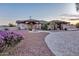 Lovely home with a circular driveway, lush landscaping, and an appealing facade, creating an inviting curb appeal at 9183 W Shamel Ash Rd, Peoria, AZ 85383