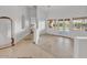 Bright, open living area with herringbone tile floor and lots of natural light at 9183 W Shamel Ash Rd, Peoria, AZ 85383