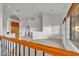 Upstairs living area featuring beautiful wood and iron handrail, and neutral color palette at 9183 W Shamel Ash Rd, Peoria, AZ 85383