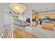 Open concept: kitchen, dining and living area with a view of the comfortable sectional sofa at 9183 W Shamel Ash Rd, Peoria, AZ 85383