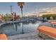 Inviting backyard pool with unique rock waterfall features and comfortable lounge chairs at 9183 W Shamel Ash Rd, Peoria, AZ 85383
