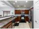 Well-lit kitchen featuring stainless steel appliances and ample cabinet space at 923 E Randy St, Avondale, AZ 85323